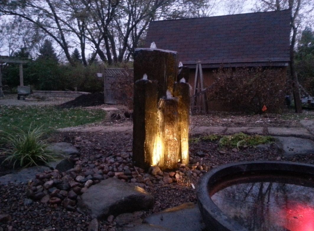 A Real Basalt Rock Column Fountain with LED Underwater Lights in Central Texas