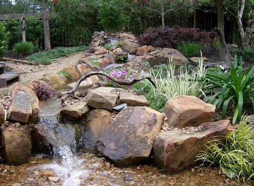 In Austin and Central Texas, We Build Pondless Waterfalls and Streams that Seem to Disappear Into the Ground